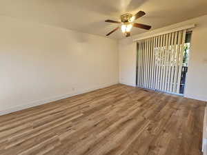 Unfurnished room with light wood-style floors and a ceiling fan