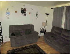 Living area featuring wood finished floors
