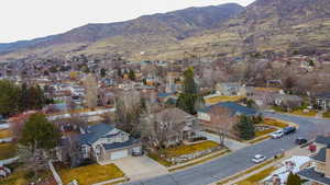Aerial view of residential area featuring mountains