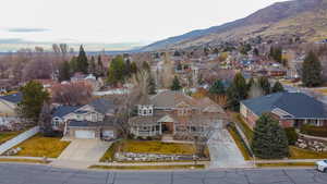 Aerial perspective of suburban area featuring a mountain backdrop