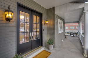 Property entrance with french doors and a porch