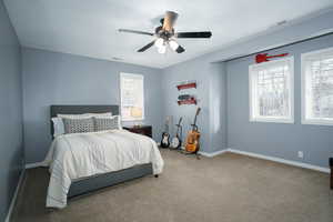 Bedroom featuring carpet flooring and a ceiling fan