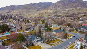 Aerial perspective of suburban area with a mountainous background