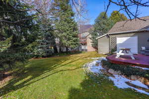 View of yard featuring a wooden deck