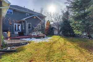 Back of property featuring a lawn, outdoor furniture, and a patio