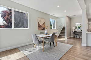 Dining area featuring light wood-type flooring and recessed lighting