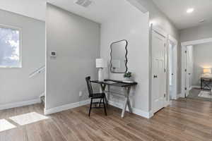 Office space featuring wood finish floors and baseboards