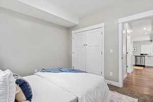 Bedroom featuring light colored carpet, a closet, and recessed lighting