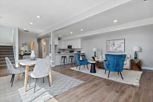 Dining space featuring wood finish floors and recessed lighting
