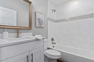 Bathroom with vanity and shower / bath combination