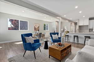 Living area featuring light wood-style flooring and recessed lighting