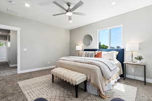 Bedroom with light colored carpet, recessed lighting, and a ceiling fan