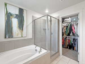 Master bathroom with large walk in closet