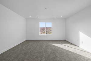 Unfurnished room with carpet and recessed lighting