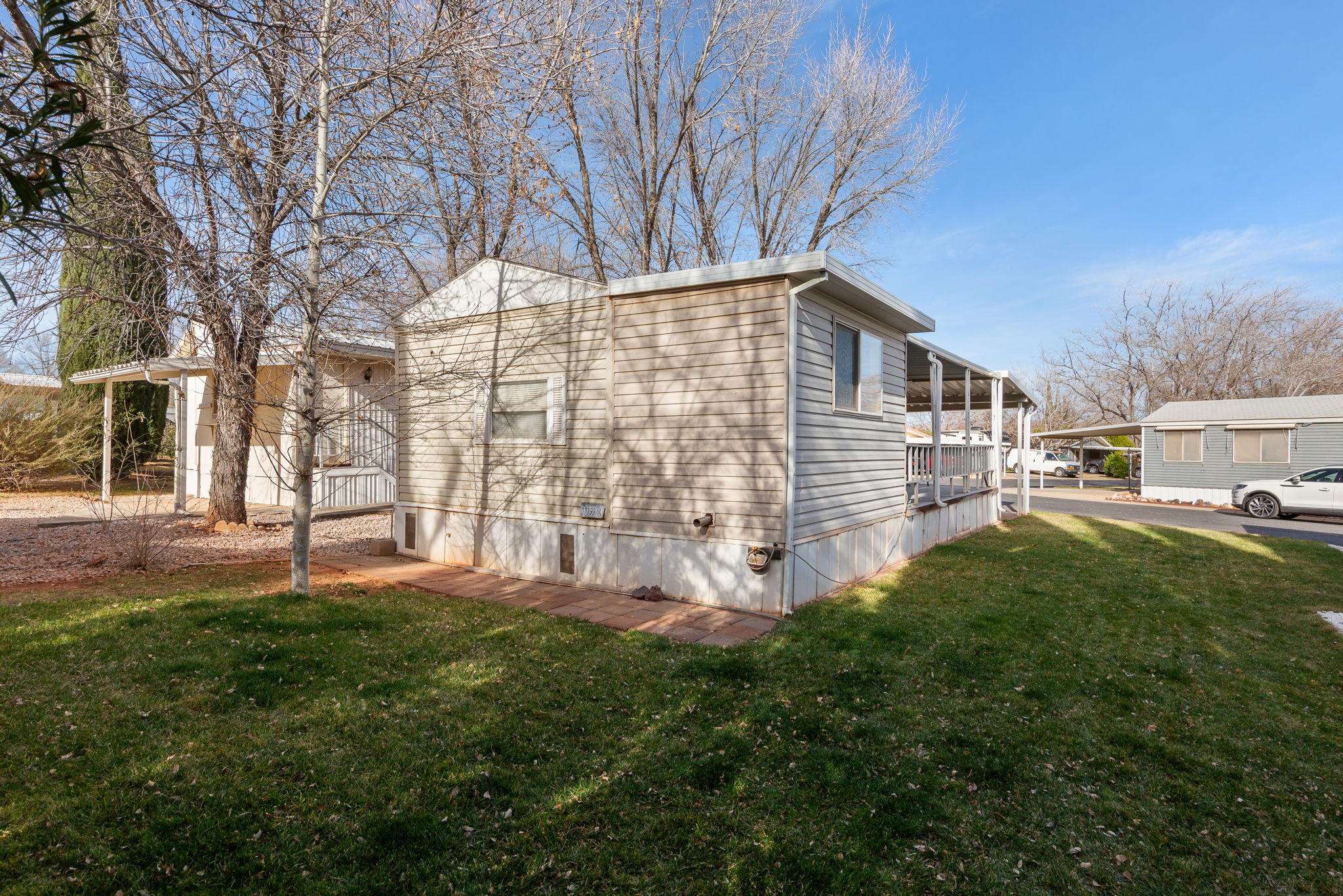View of side of property with a yard