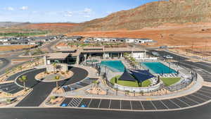 Aerial view of a pool area and a mountain backdrop