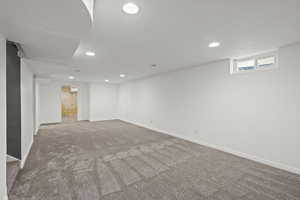 Basement with carpet floors and recessed lighting
