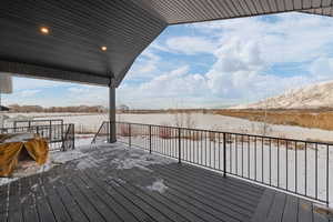 View of spacious covered Trex deck with agricultural and mountain views