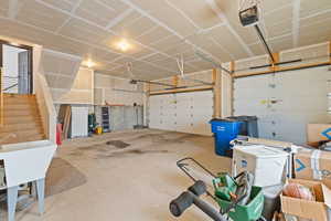 Oversized garage featuring work sink
