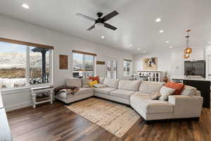 Open concept floorplan featuring large kitchen, spacious semi-formal dining area, living room, and access to a covered back deck.