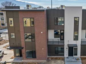 Photos are of a completed unit - View of building exterior featuring a mountain view