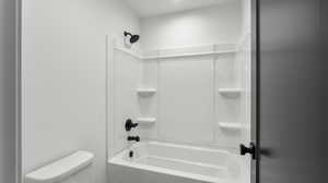 Photos are of a completed unit - Full bath with toilet and shower / bathtub combination