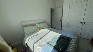 Bedroom featuring a closet and carpet flooring