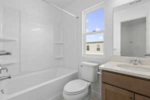 Bathroom featuring vanity and bathing tub / shower combination