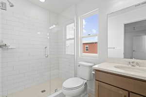 Bathroom with vanity and a stall shower