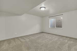 Unfurnished room with light carpet and baseboards