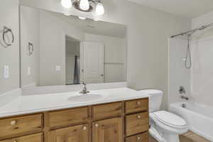 Bathroom featuring vanity, shower / washtub combination, and light tile patterned floors