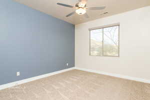 Unfurnished room featuring light carpet and ceiling fan