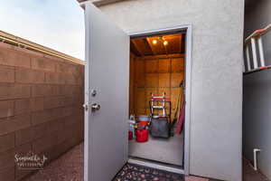 Doorway to property featuring stucco siding