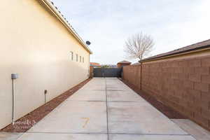 View of property exterior featuring a fenced backyard and stucco siding