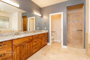 Full bath with double vanity and walk in shower