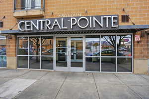 Doorway to property with french doors and brick siding
