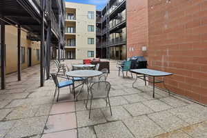 View of patio / terrace featuring outdoor dining area and a grill