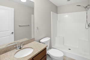 Bathroom with vanity and a stall shower