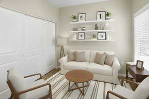 Living room with baseboards and light wood-style floors