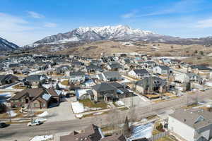 Aerial perspective of suburban area with a mountainous background