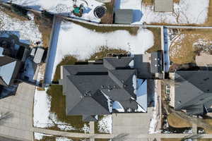 Snowy aerial view with a residential view