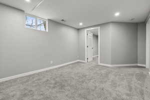 Basement featuring light carpet and recessed lighting