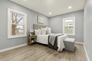 Bedroom featuring light wood finished floors and recessed lighting