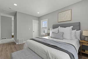 Bedroom featuring light wood finished floors and recessed lighting