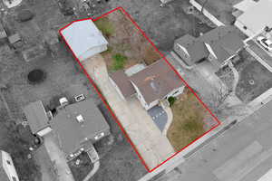 Aerial view of residential area with property boundaries highlighted