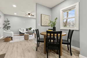 Dining area featuring light wood-type flooring, a ceiling fan, and recessed lighting