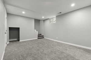 Below grade area featuring carpet flooring and recessed lighting