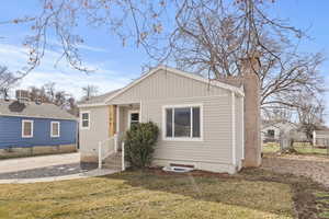 Bungalow-style house with a chimney