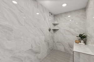 Bathroom featuring a tile shower