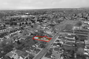 Aerial view of residential area with property parcel outlined